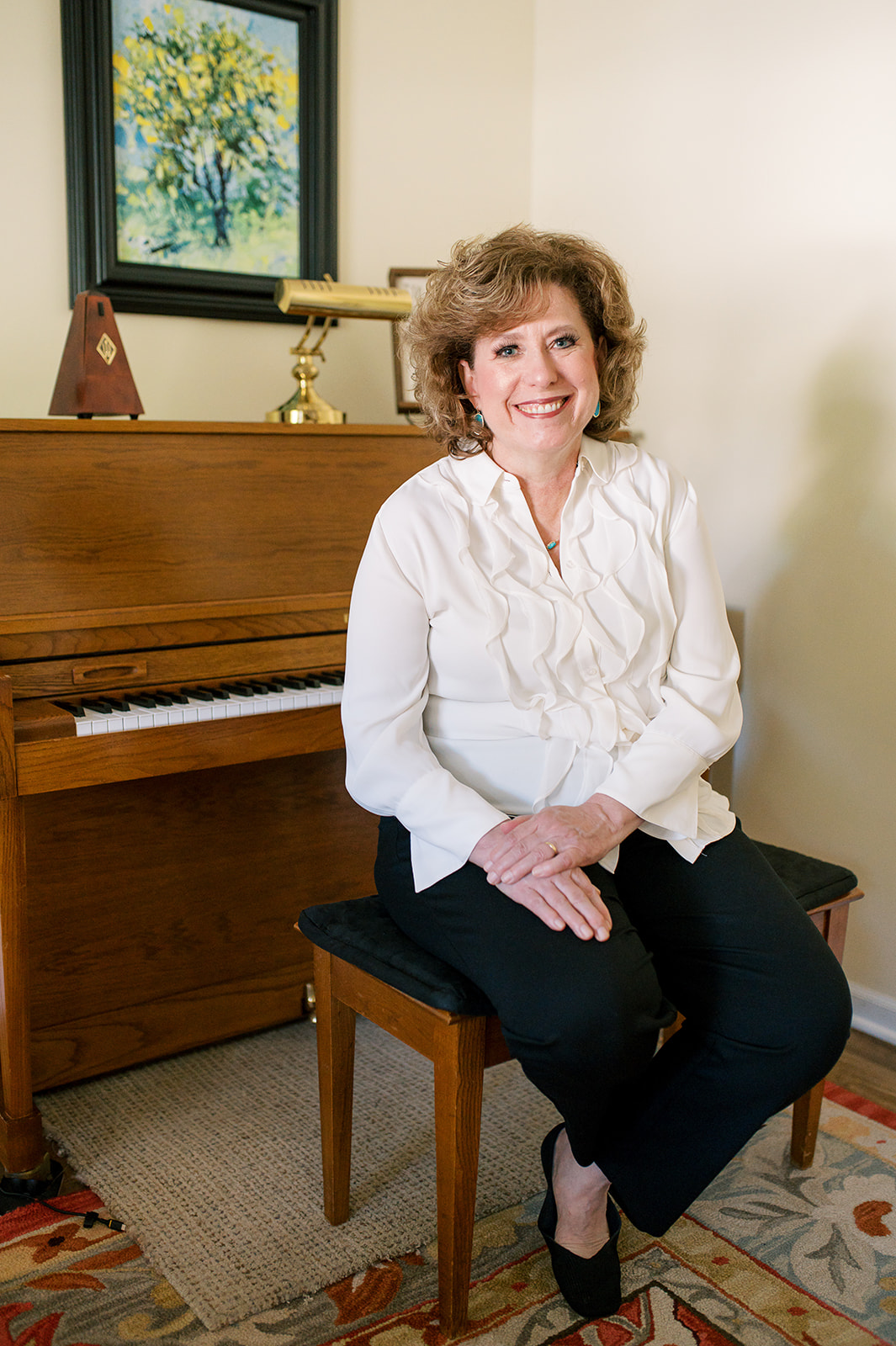 Amy sitting in front of the piano